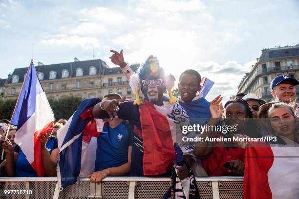 Spectators and supporters of the French team watch the semi final of the 2018 World Cup between France and Belgium on a giant screen at the Hotel de...