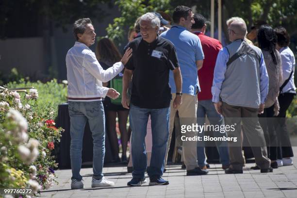 Brian Grazer, co-chairman of Imagine Entertainment, left, greets Leslie Moonves, president and chief executive officer of CBS Corp., after a morning...