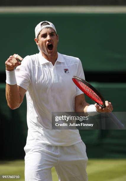 John Isner of The United States celebrates winning the second set against Kevin Anderson of South Africa during their Men's Singles semi-final match...