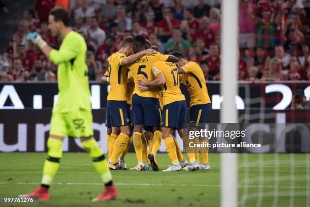 Madrid players celebrate their 1:0 goal during the Audi Cup final Atletico Madrid vs FC Liverpool match in the Allianz Arena in Munich, Germany, on 2...