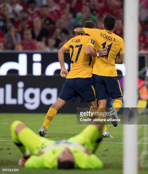 Keidi Bare celebrates with Angel Correa, both of Madrid, over the 1:0 goal during the Audi Cup final Atletico Madrid vs FC Liverpool match in the...