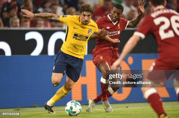 Liverpool's Joel Matip and Madrid's Vrsaljko vie for the ball during the Audi Cup final soccer match between Atletico Madrid and FC Liverpool in the...