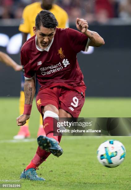 Liverpool's Roberto Firmino takes a penalty during the Audi Cup final soccer match between Atletico Madrid and FC Liverpool in the Allianz Arena in...