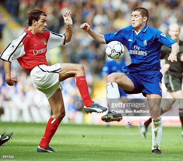 Robert Pires of Arsenal challenges Frank Lampard of Chelsea during the FA Barclaycard Premiership match between Chelsea and Arsenal at Stamford...