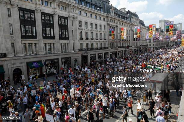 Demonstrators march along Regent Street during a protest against U.S. President Donald Trump in central London, U.K., on Friday, July 13, 2018....