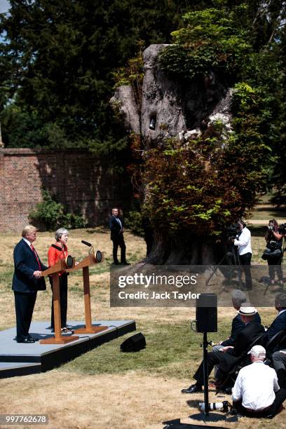 British Prime Minister Theresa May and U.S. President Donald Trump attend a joint press conference following their meeting at Chequers on July 13,...