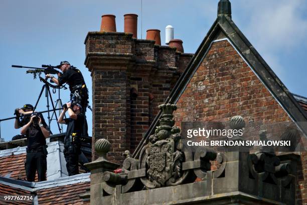 Snipers watch from atop the Chequers prior to a joint press conference held by US President Donald Trump and Britain's Prime Minister Theresa May...