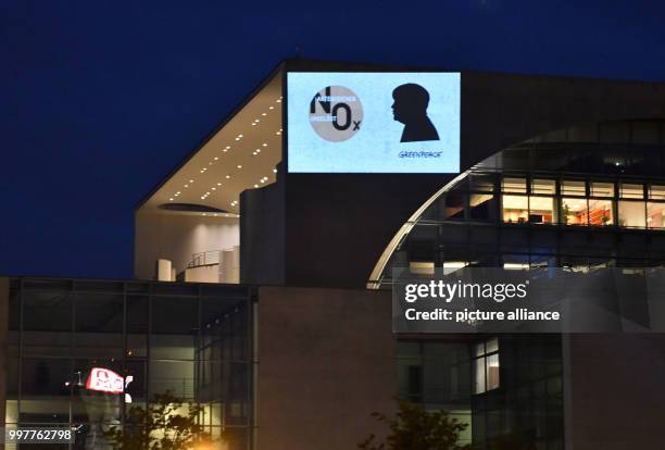 "Case number unsolved - NOX" is being projected onto a wall of the German chancellery in Berlin, Germany, 3 August 2017. "Greenpeace" activists are...