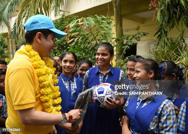 Consul-General of Thai consulate in Mumbai Ekapol Poolpipat interacts with Indian students at the Rajabhagat Vidhyalaya school in Ahmedabad on July...