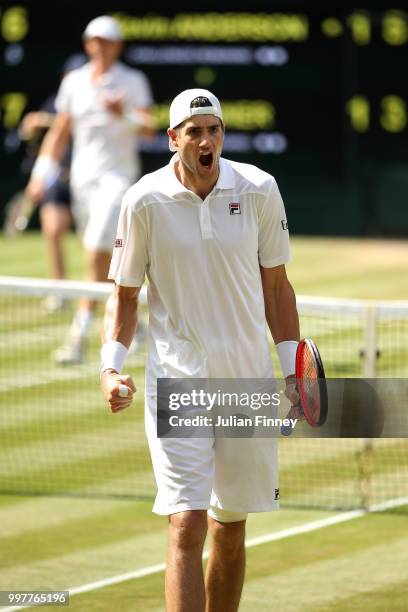 John Isner of The United States celebrates a point against Kevin Anderson of South Africa during their Men's Singles semi-final match on day eleven...