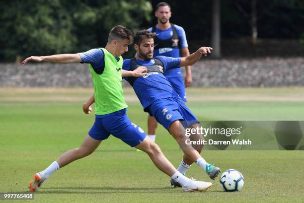 Mason Mount and Cesc Fabregas of Chelsea during a training session at Chelsea Training Ground on July 13, 2018 in Cobham, England.