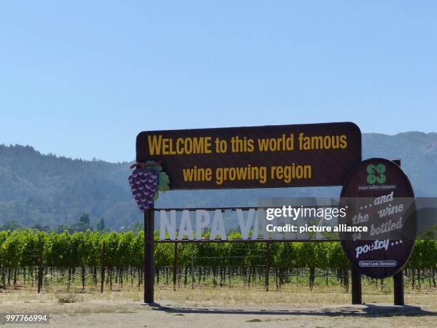 Sign that reads Welcome to this world famous wine growing region, NAPA VALLEY" is standing at the entrance of the wine region "Napa Valley" in Napa,...
