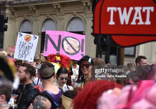 Demonstrators with an anti Trump placards attend the Drag Protest Parade LGBTQi March against Trump on July 13, 2018 in London, United Kingdom. Drag...