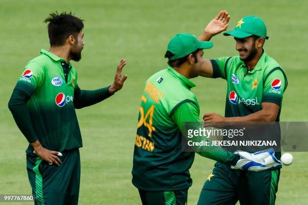 Pakistan's captain Sarfraz Ahmed celebrates victory with his players after the first one day international cricket match between Pakistan and...