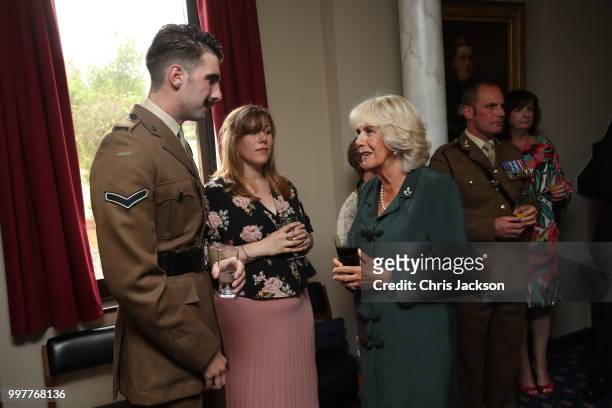 Camilla, Duchess of Cornwall speaks to Corporal Jack Stock during a visit to New Normandy Barracks on July 12, 2018 in Aldershot, England.