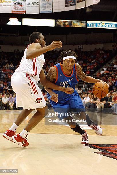 Deron Washington of theTulsa 66ers dribbles against Ernest Scott of the Rio Grande Valley Vipers in Game Two of the 2010 NBA D-League Finals at the...