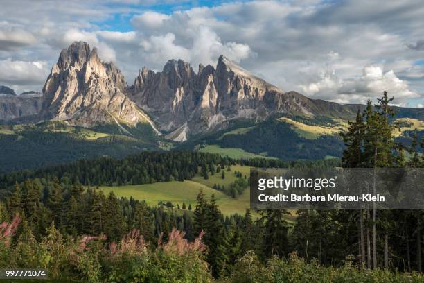 langkofel emerging from the clouds - klein stock pictures, royalty-free photos & images