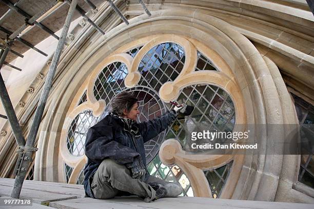 Conservator Sharon Bailey puts finishing touches to a stained glass window on Westminster Abbey's Chapter House on April 14, 2010 in London, England....