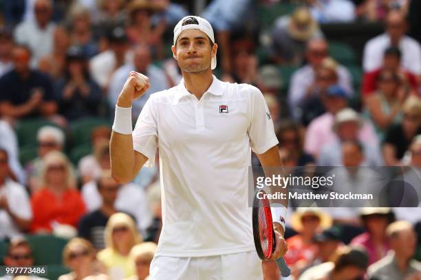 John Isner of The United States celebrates winning the third set against Kevin Anderson of South Africa during their Men's Singles semi-final match...