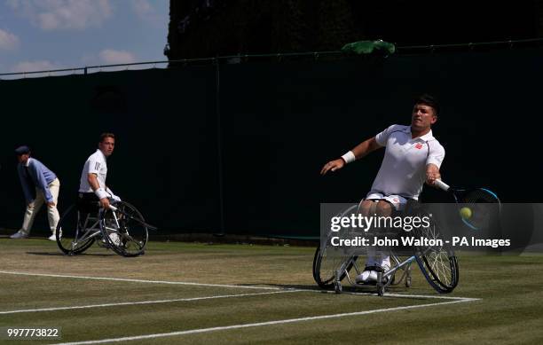 Alfie Hewett and Gordon Reid in action in the doubles on day eleven of the Wimbledon Championships at the All England Lawn Tennis and Croquet Club,...
