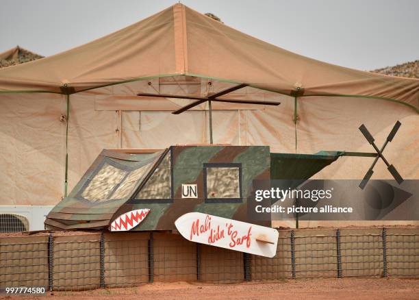 Self made helicopter with a sign that reads "Mali didn't surf" is standing in Camp Castor in Gao, Mali, 30 July 2017. Photo: Britta Pedersen/dpa