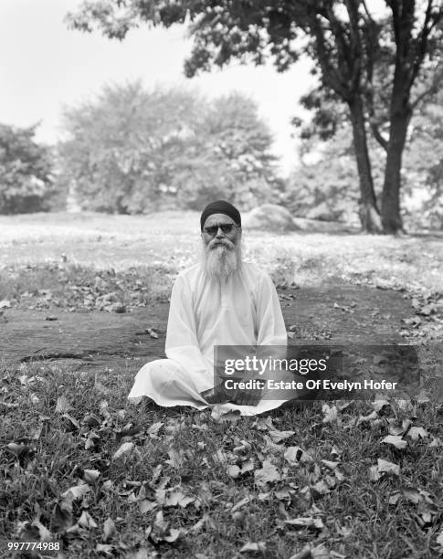 Hindu guru sitting cross-legged in Central Park, New York City, 1973.