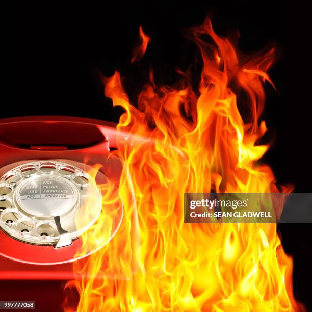 red telephone and flames - 1970 2010 stock pictures, royalty-free photos & images