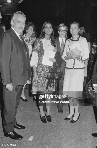 Rainier III, Prince of Monaco, and Grace Kelly, Princess of Monaco, with their daughter Caroline and son Albert at the Aldwych Theater in London, UK,...