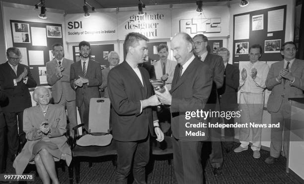 President Patrick Hillery presenting award to Matt Hayes the winner of the Graduate Designer Award at the National Yacht Club, Dun Laoghaire, circa...