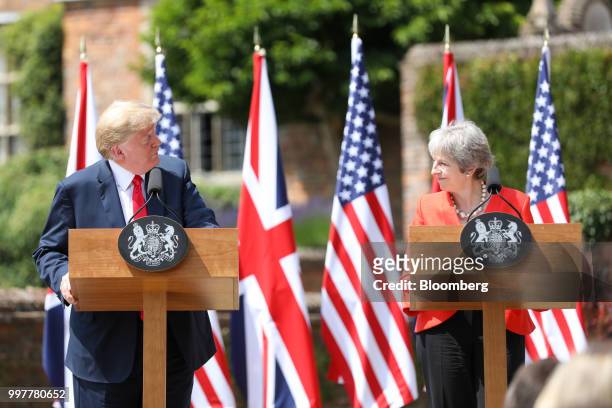 President Donald Trump, left, looks to Theresa May, U.K. Prime minister, right, during a joint news conference at Chequers in Aylesbury, U.K., on...
