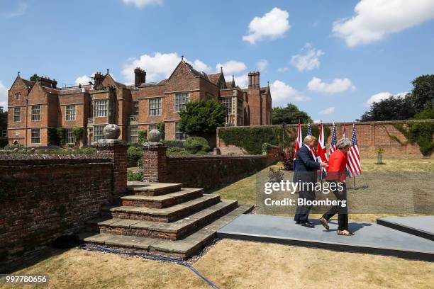 President Donald Trump, left, and Theresa May, U.K. Prime minister, right, arrive for a joint news conference at Chequers in Aylesbury, U.K., on...