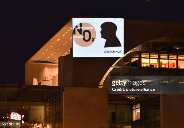 "Case number unsolved - NOX" is being projected onto a wall of the German chancellery in Berlin, Germany, 3 August 2017. "Greenpeace" activists are...