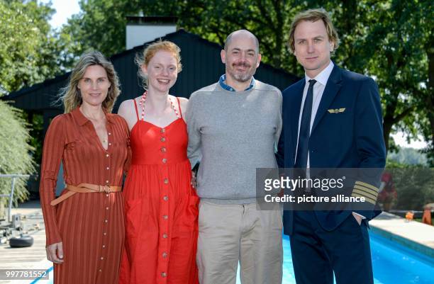 July 2018, Wedel, Germany: Actors Nele Mueller-Stoefen , Matilda Berger, director Edward Berger and actor Lars Eidinger on set of the film...