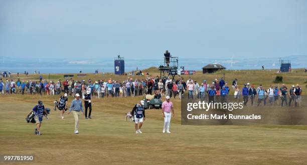 Matt Kucher of USA walks with Stephen Gallacher of Scotland and Lee Westwood of England to the 16th green during the second day of the Aberdeen...