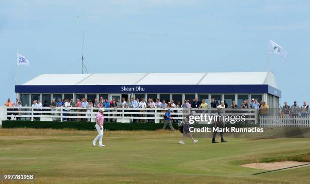 Stephen Gallacher of Scotland and Lee Westwood of England walk to the 17th green during the second day of the Aberdeen Standard Investments Scottish...
