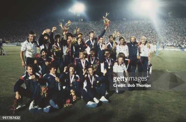 The France football team pictured wearing their gold medals after beating Brazil 2-0 in the final of the football tournament at the 1984 Summer...