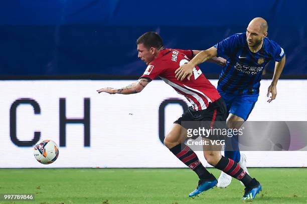 Gabriel Paletta of Jiangsu Suning and Pierre-Emile Hojbjerg of Southampton compete for the ball during the 2018 Clubs Super Cup match between...