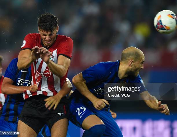 Gabriel Paletta of Jiangsu Suning and Wesley Hoedt of Southampton compete for the ball during the 2018 Clubs Super Cup match between Southampton FC...