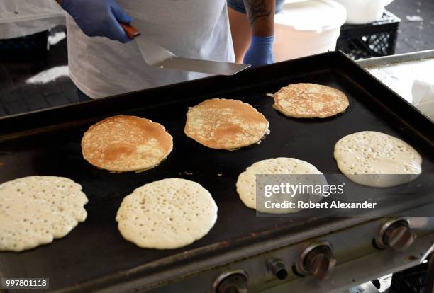 Volunteers cook pancakes at a Fourth of July fund-raising pancake breakfast and holiday event in Santa Fe, New Mexico.