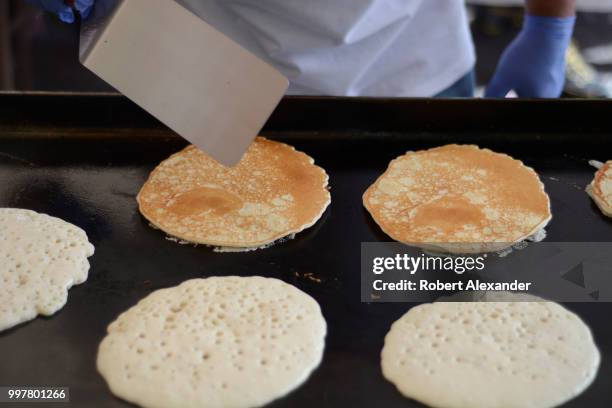 Volunteers cook pancakes at a Fourth of July fund-raising pancake breakfast and holiday event in Santa Fe, New Mexico.