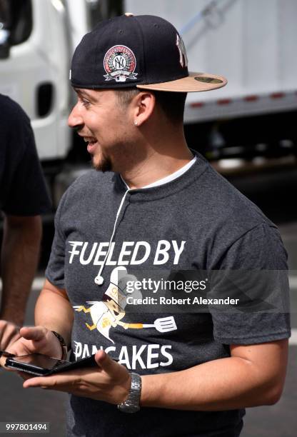 Man wears a New York Yankees ballcap and 'Fueled by pancakes' T-shirt at a Fourth of July fund-raising pancake breakfast and holiday event in Santa...