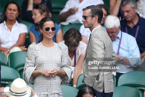 Pippa and James Matthews arrive on centre court to watch South Africa's Kevin Anderson play US player John Isner in their men's singles semi-final...