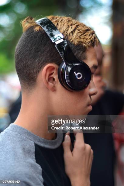 Teenage boy wears Beats by Dr. Dre headphones in Santa Fe, New Mexico.