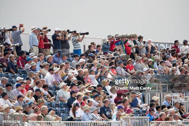 Aviation enthusiast watch the Turkish Air Force's F-16 demonstration display performs at the Royal International Air Tattoo at RAF Fairford on July...