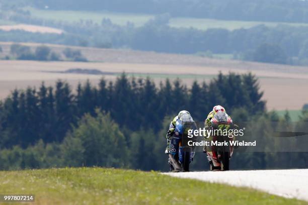 Dominique Aegerter of Switzerland and Kiefer Racing Team and Andrea Locatelli of Italy and Italtrans Racing Team rides in free practice during the...
