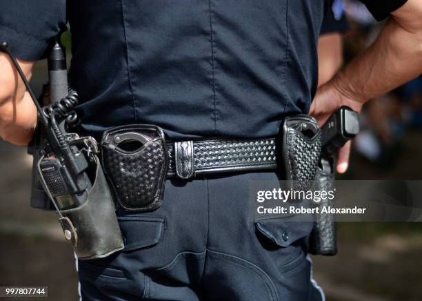 Police officer keeps an eye on the crowd at a Fourth of July holiday event in Santa Fe, New Mexico.