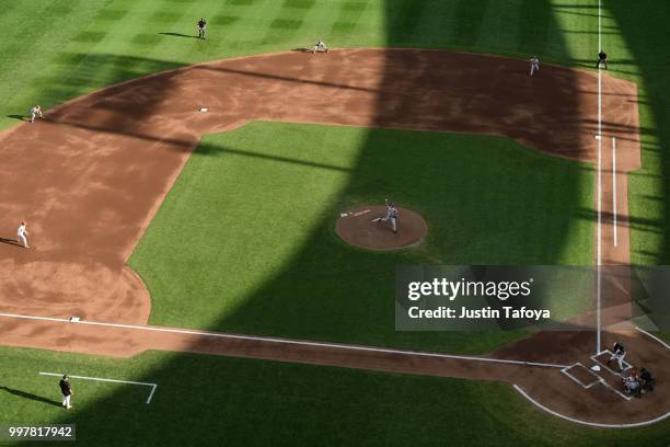 Blaine Knight of the Arkansas Razorbacks delivers a pitch against the Oregon State Beavers during the Division I Men's Baseball Championship held at...