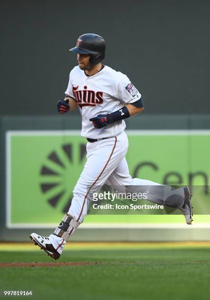 Minnesota Twins Second base Brian Dozier rounds the bases after hitting a solo home run during a MLB game between the Minnesota Twins and Kansas City...