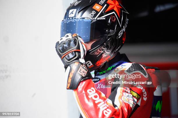 Scott Redding of Great Britain and Aprilia Racing Team Gresini looks on in pit during the MotoGp of Germany - Free Practice at Sachsenring Circuit on...