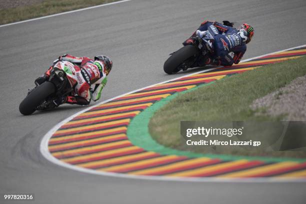 Maverick Vinales of Spain and Movistar Yamaha MotoGP leads Scott Redding of Great Britain and Aprilia Racing Team Gresini during the MotoGp of...